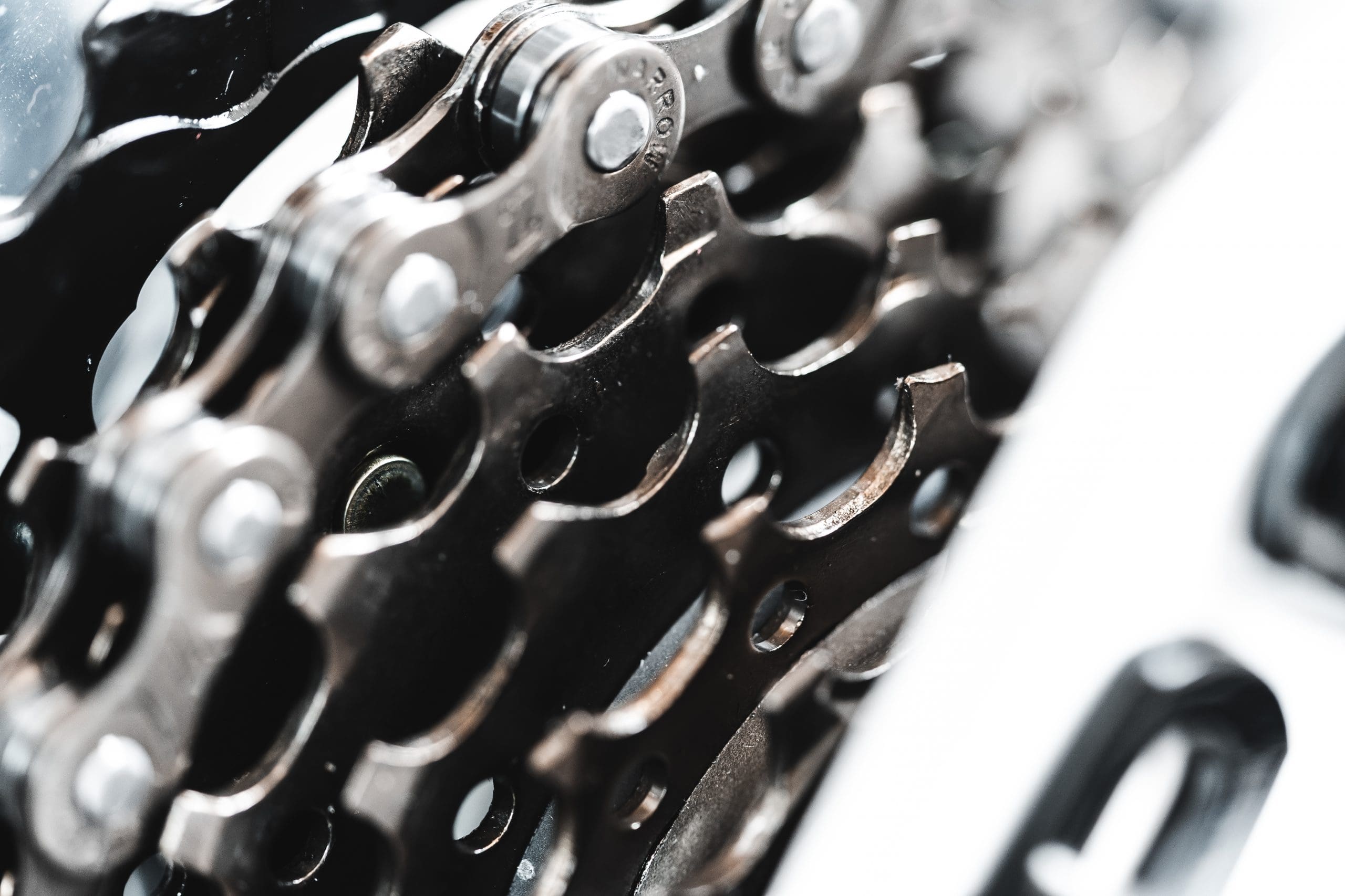 Close up of a bicycle gear sprocket engaged with a chain.