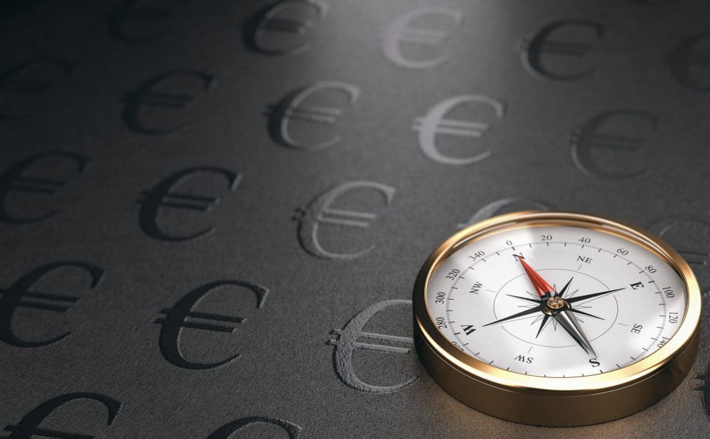 A compass on a black background representing strategic services.
