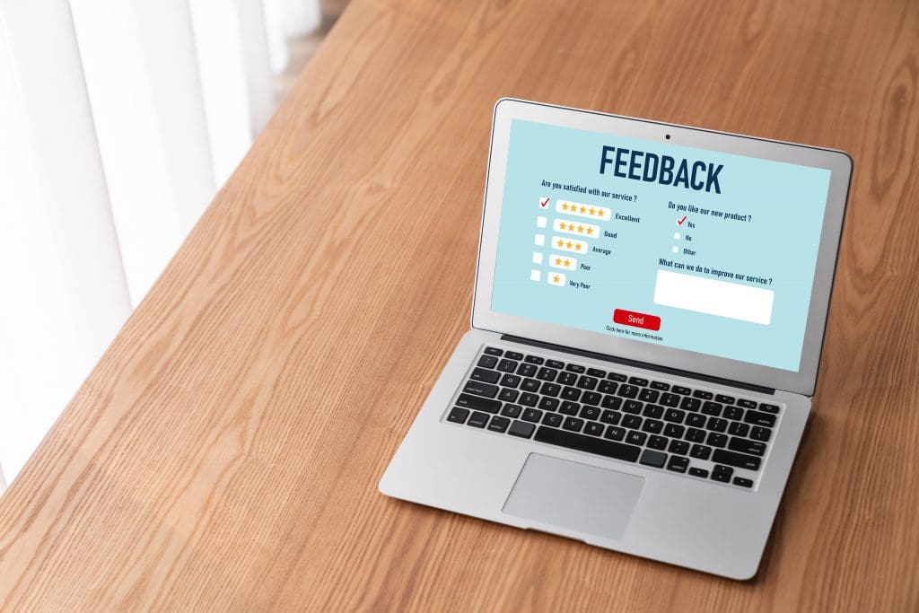 Laptop with a customer feedback survey showing representing external quality assessment service.